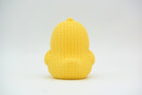 Texture detail of knitted chick showing soft ribbed crochet-like surface pattern in yellow