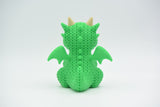 Detailed texture shot of the knitted dragon showing the looped crochet-like pattern across its body