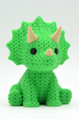 Close-up of a knitted triceratops figurine with textured crochet surface and three horns, 49 DKK