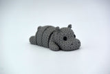 Detail shot of the knitted hippo's segmented body showing the soft woven texture and flexible joints