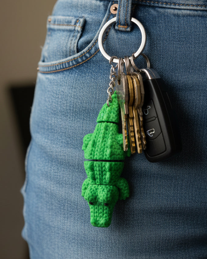Detail shot of the scaled texture on a knitted crocodile showing the soft crochet-like surface pattern