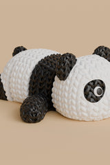 Knitted articulated panda figure in black and white with crochet-look texture, full body close-up on white background