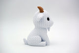 Texture detail of the knitted goat showing the fine loop pattern across the body surface