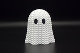 Close-up of a knitted Halloween ghost decoration with open crochet-look texture, 49 DKK at Cool3d.dk
