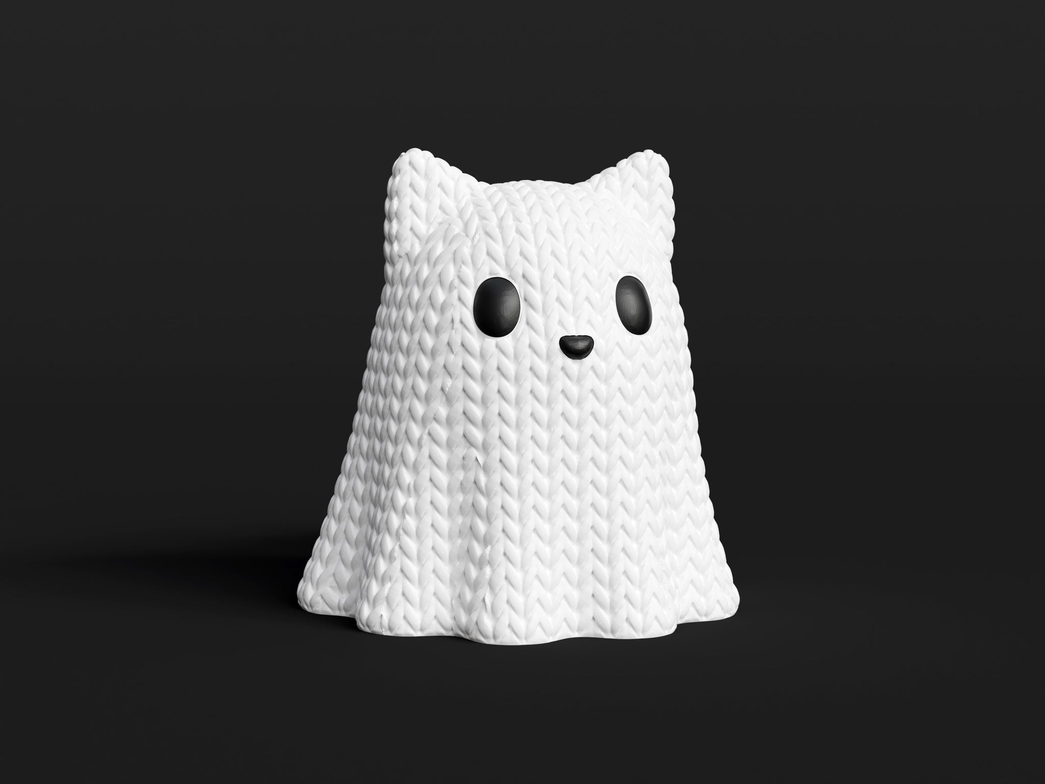 Close-up of a knitted cat ghost decoration with soft crochet texture, white and ghostly form with cat ears
