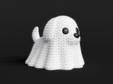 Texture detail of the knitted dog ghost showing looping crochet-style surface pattern on the ghost figure