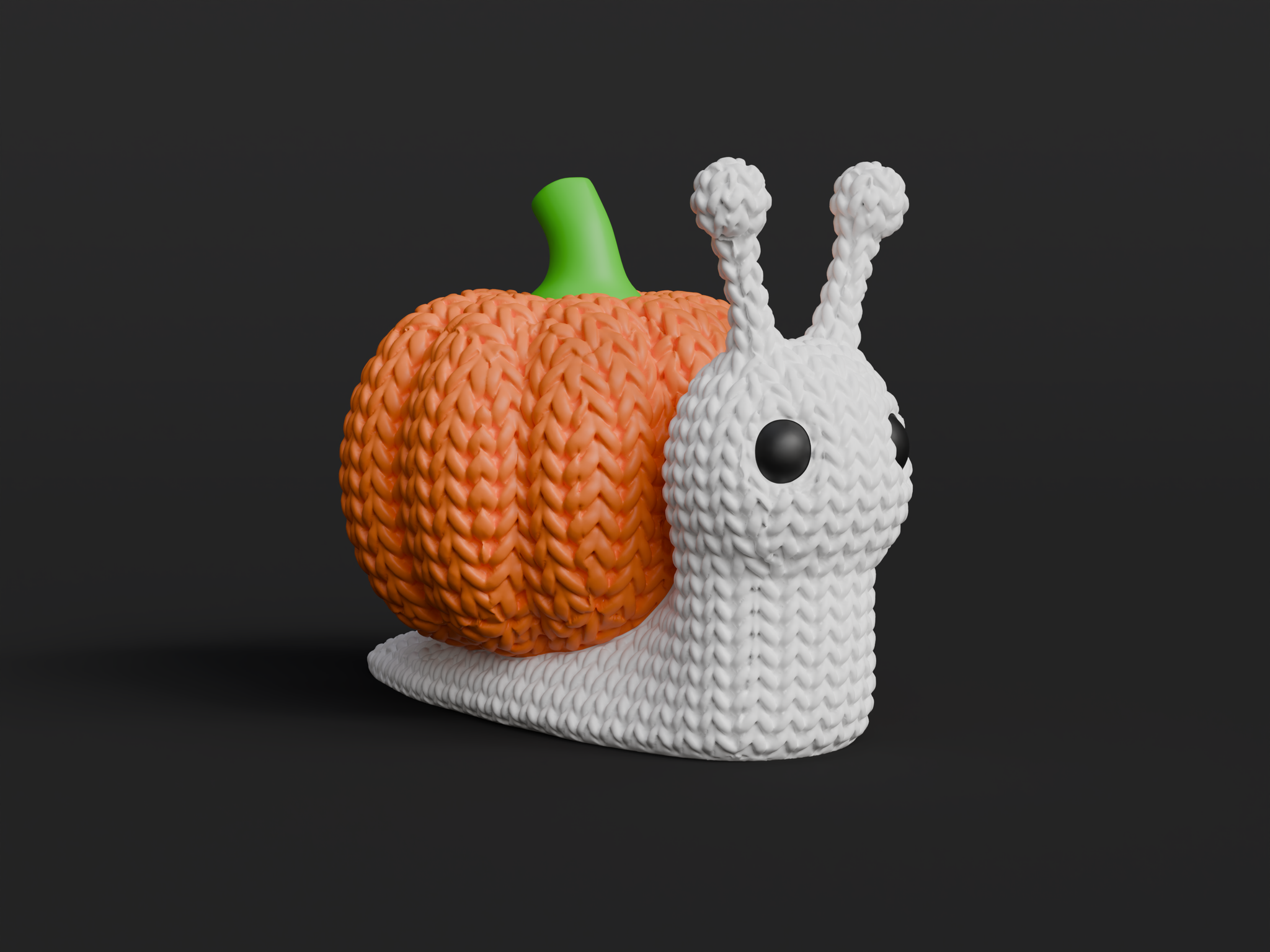 Close-up of a knitted pumpkin snail decoration with soft crochet texture and orange ribbed shell, on white background