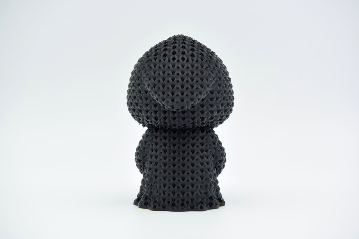 Texture detail of the crochet grim reaper showing the open weave pattern across the robe and hood