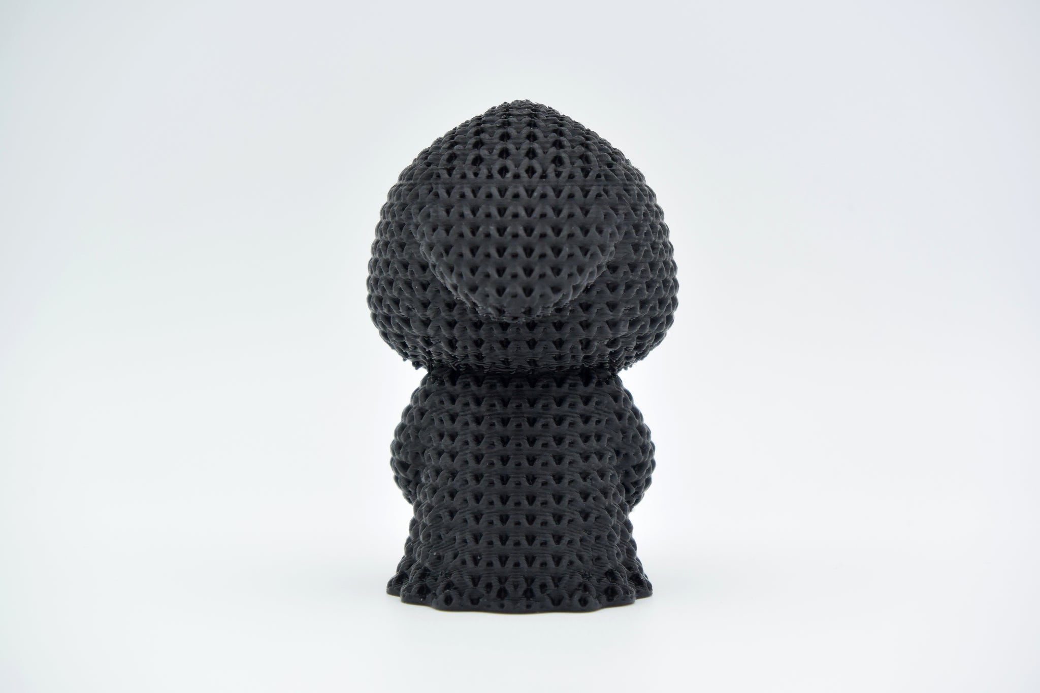 Texture detail of the crochet grim reaper showing the open weave pattern across the robe and hood
