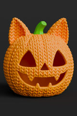 Close-up of a crochet cat pumpkin with knitted texture and carved jack-o-lantern cat face, orange