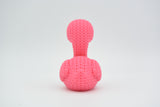 Detail shot of the looping crochet-look texture on the surface of a pink flamingo figurine