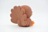 Detail shot of the crochet-look texture on the body of a knitted turkey decoration