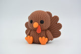 Close-up of a knitted turkey decoration with textured woven surface and fanned tail feathers, 49 DKK