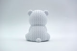 Texture detail of the knitted polar bear surface showing the interlocking weave pattern across the bear's back