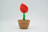 Detail shot of the knitted rose surface showing the layered textile-like texture of each petal