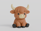 Close-up of a knitted highland cow figurine with a textured crochet-look coat and small sculpted horns