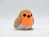 Close-up of a knitted robin bird figure with textured crochet-look surface and warm red breast, 49 DKK