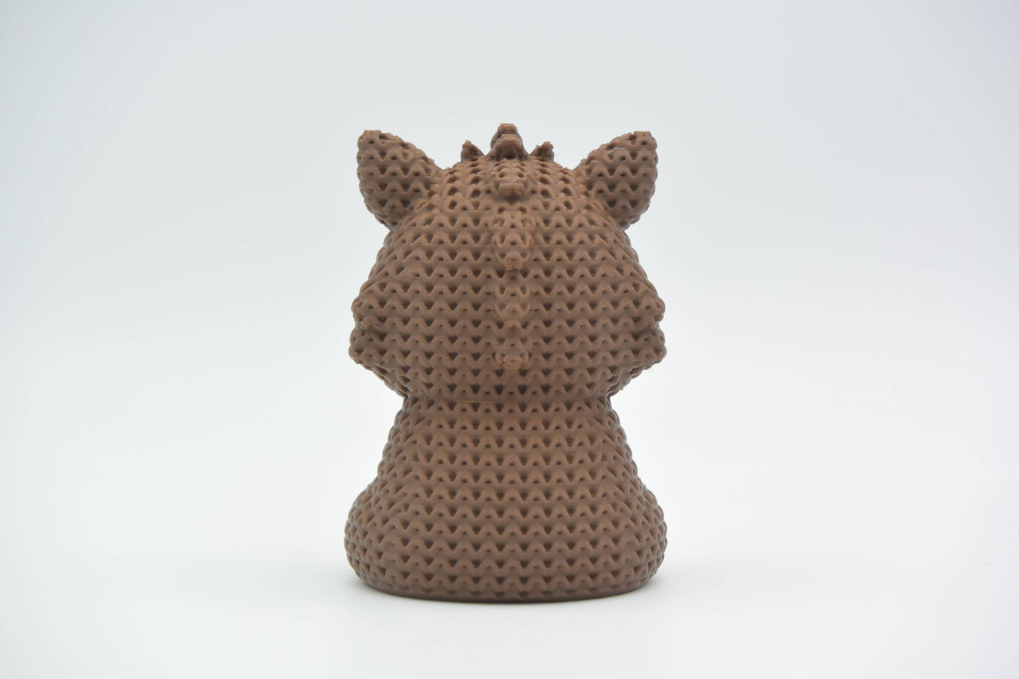 Detail shot of the looped crochet-look surface texture on a solid wild boar figurine