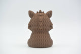 Detail shot of the looped crochet-look surface texture on a solid wild boar figurine