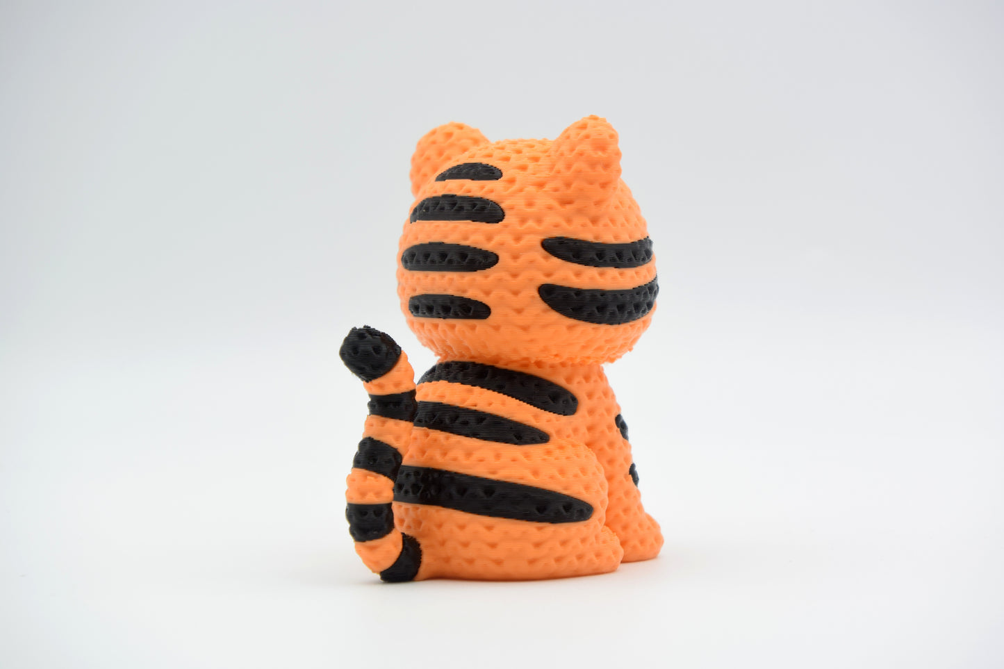 Detail shot of the crochet-look texture on the back and tail of a decorative tiger figurine