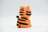 Detail shot of the crochet-look texture on the back and tail of a decorative tiger figurine