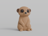 Close-up of a knitted meerkat figurine with a crochet-texture surface, standing upright on a white background
