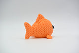 Detail of the crochet-look surface texture on a decorative knitted fish figurine