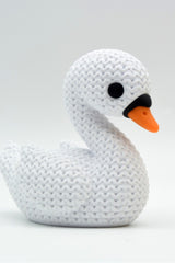 Close-up of a knitted swan decoration showing soft crochet-look texture across the wings and body