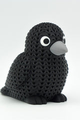 Close-up of a knitted crow figurine with a crochet-look texture and detailed snap-fit eyes, 49 DKK