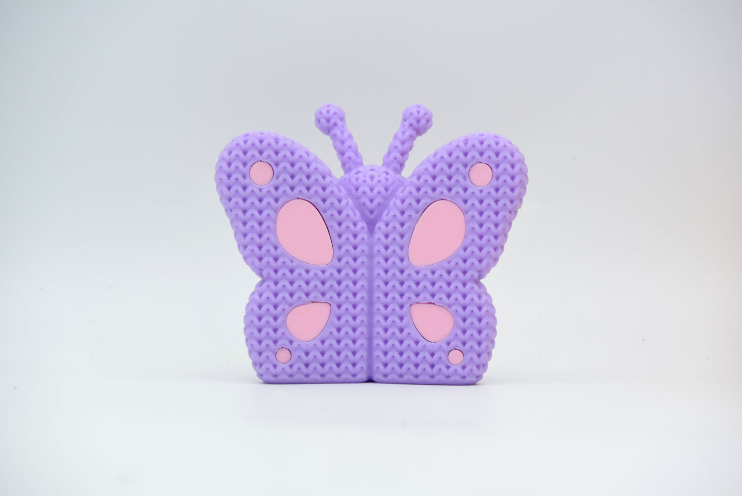Detail of the crochet-look surface texture on a decorative butterfly figurine from Cool3d.dk