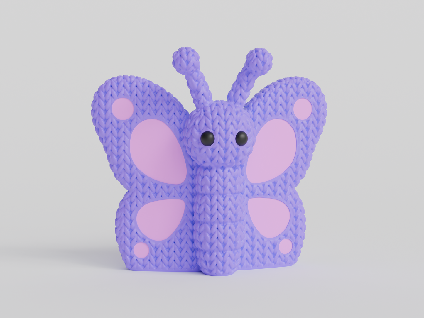Close-up of a knitted butterfly decoration with crochet-texture wings in warm tones, 49 DKK