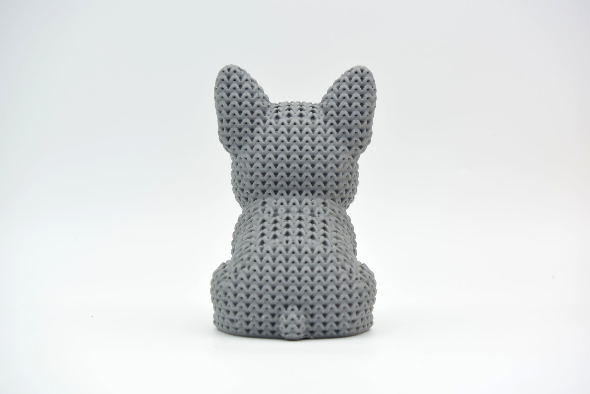 Texture detail of the knitted French Bulldog surface showing the soft, looped pattern that mimics handmade crochet