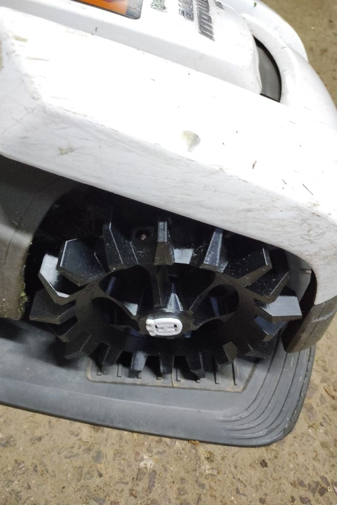 Husqvarna Automower 305 off-road wheel — spiked tread profile